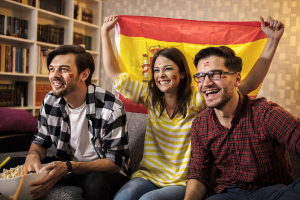istock Spanish supporters rejoices watching television 1256923677