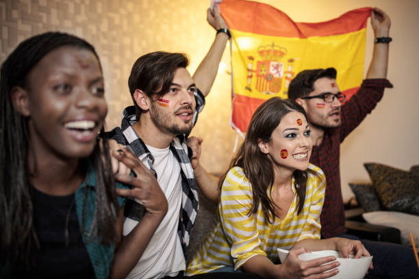 istock Spanish supporters rejoices watching television 1256923678