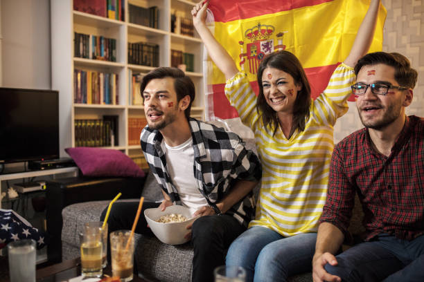 istock Spanish supporters rejoices watching television 1256923779