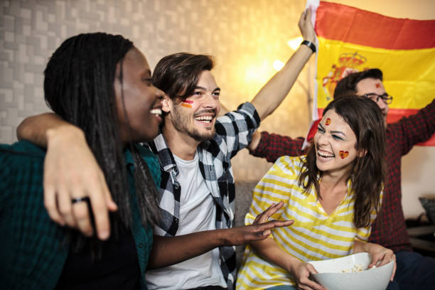 istock Spanish supporters rejoices watching television 1256923804