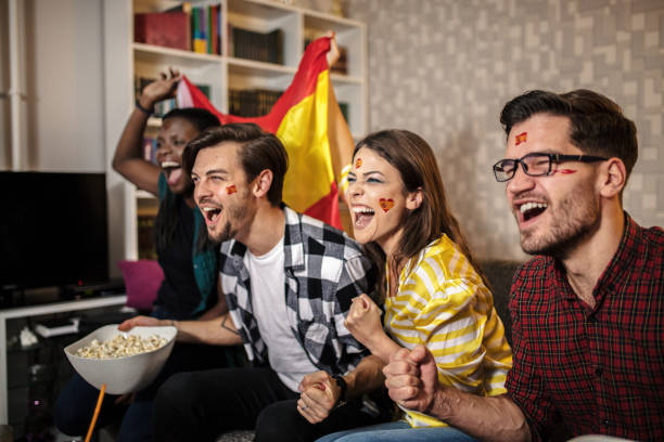istock Spanish supporters rejoices watching television 1256924725