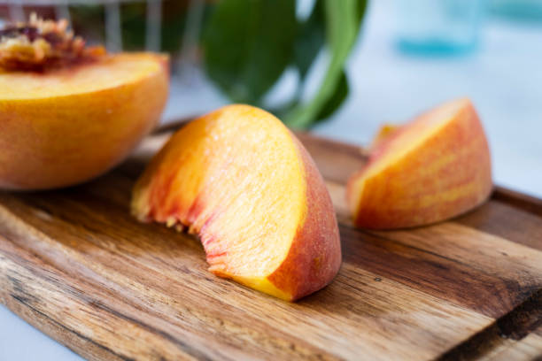 istock Fresh Peach Cut on a Cutting Board 1256926958