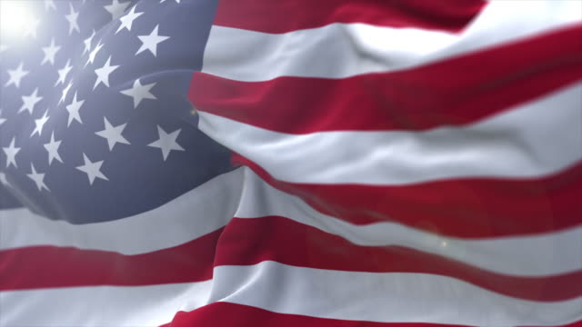 Slow motion shot of the United States flag with lens flare