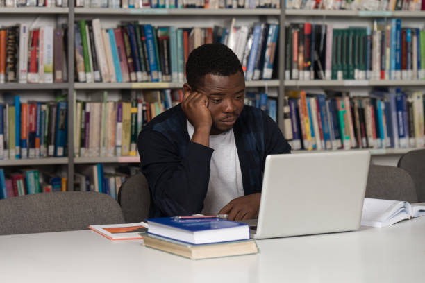 istock Male College Student Stressed About His Homework 1256931014