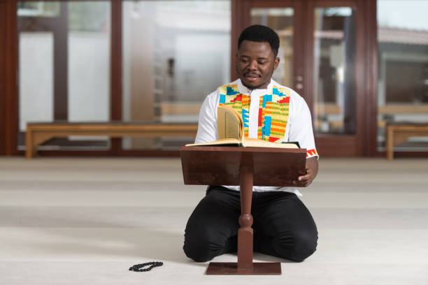 istock African Muslim Man Is Reading The Koran 1256931643