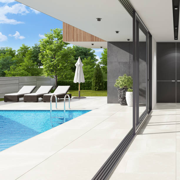 istock Luxurious villa interior with swimming pool at summer daylight scene 1256932539
