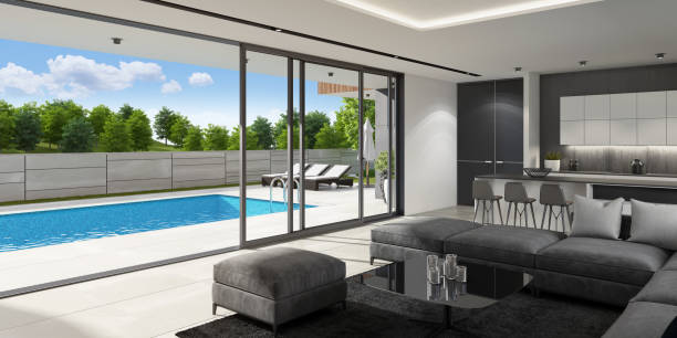 istock Luxurious villa interior with swimming pool at summer daylight scene 1256932642