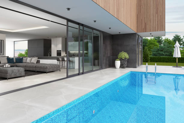 istock Luxurious villa interior with swimming pool at summer daylight scene 1256932690