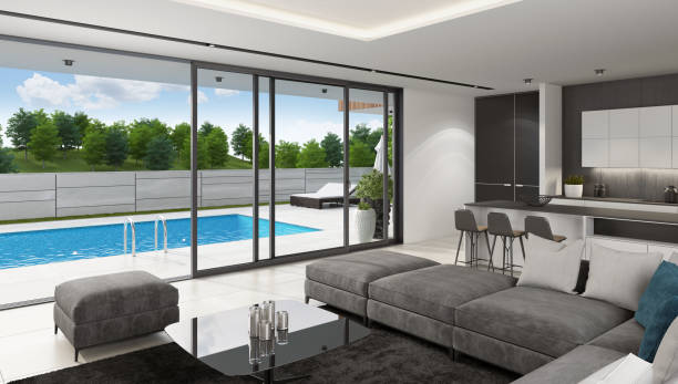 istock Luxurious villa interior with swimming pool at summer daylight scene 1256932705