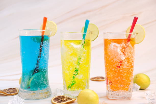istock Colorful cocktails on table background 1256934011