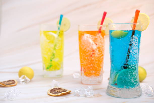 istock Refreshing summer drinks and alcoholic cocktails on the table background 1256934128