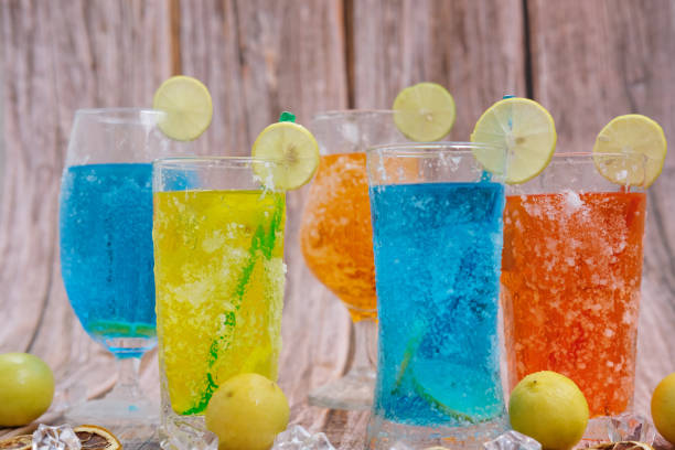 istock Various refreshments cocktail with lime juice and summer drinks on wood table 1256935680