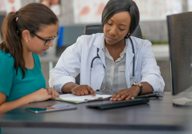 istock Woman has medical appointment 1256944432