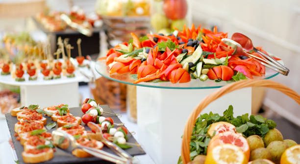 istock a covered self-service table organized catering with fruit vegetables and sandwiches 1256945137