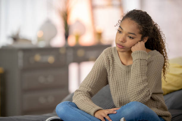 istock Teenage girl struggles with depression 1256947070