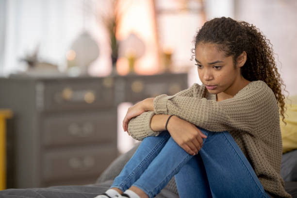 istock Teenage girl struggles with depression 1256947080