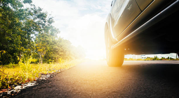 istock Road at countryside, clean asphalt with empty car and beautiful clear blue sky background, Driving safely and car insurance concept use. 1256947848