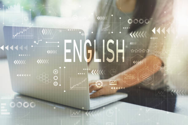 istock English with woman using laptop 1256947904