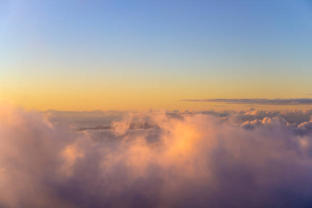 istock Soft Misty Sunset Above the Clouds 1256952416