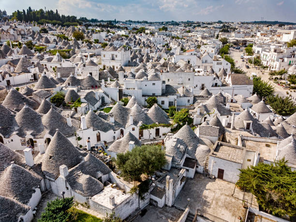 Trulli houses in Alberobello, Bari, Italy Trulli houses in Alberobello town. A trullo is a traditional Apulian dry stone hut with a conical roof. alberobello photos stock pictures, royalty-free photos & images