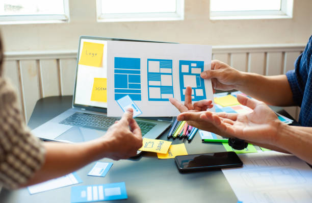 istock Designers brainstorm ideas for designing mobile applications. 1256957106