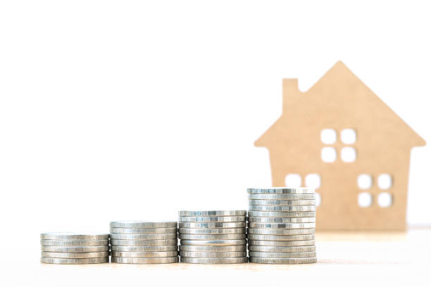 istock House model and stack of coins on table 1256957804