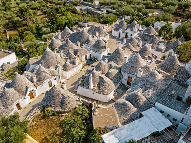 Trulli houses in Alberobello, Bari, Italy Trulli houses in Alberobello town. A trullo is a traditional Apulian dry stone hut with a conical roof. trulli house stock pictures, royalty-free photos & images