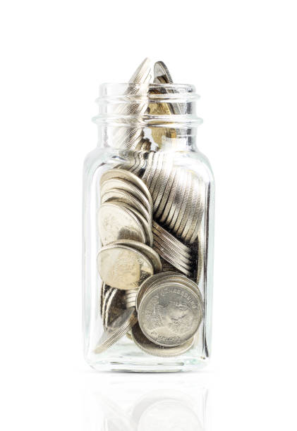 istock Coins in jars Isolated on white background, finance 1256958709