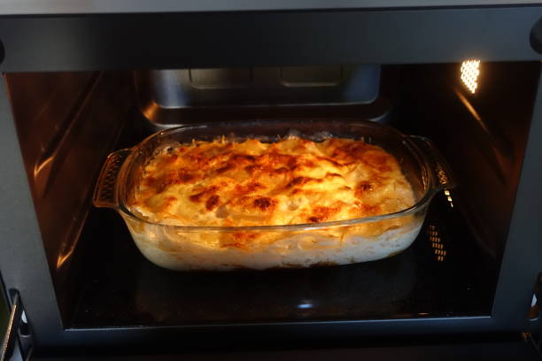 istock Potato gratin being cooked in an oven 1256962749