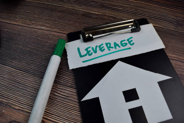 istock Leverage write on sticky notes and house made from paper isolated on the table. 1256967293