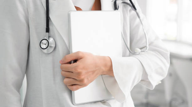 istock Doctor in white background stethoscope tablet in hospital 1256972473