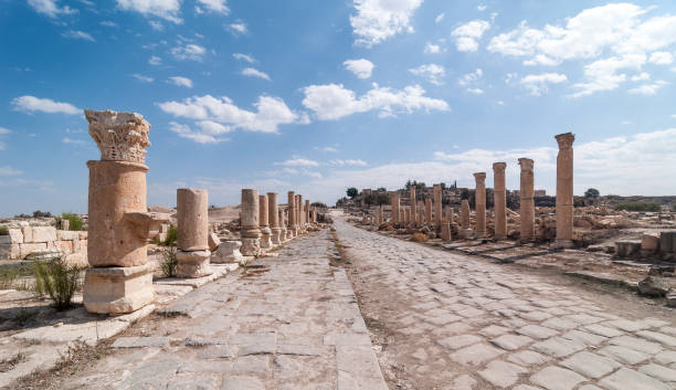 istock View Along Roman Road lined with Columns, Jordan 1256978735