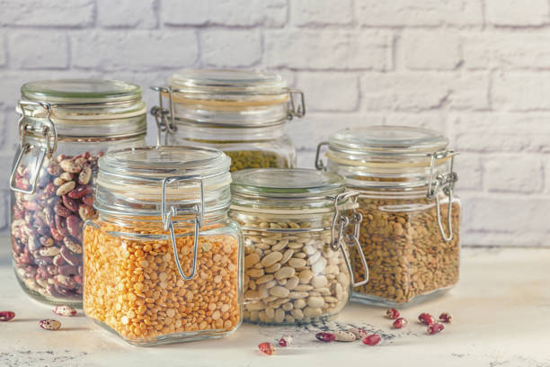 istock Glass jars with various legumes 1256985449