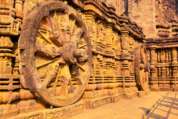 Stone chariot in Konark Sun Temple Beautiful stone chariot in Konark Sun Temple dedicated to hindu god of the sun - Surya. Konark, Odisha, India chariot wheel at konark sun temple india stock pictures, royalty-free photos & images