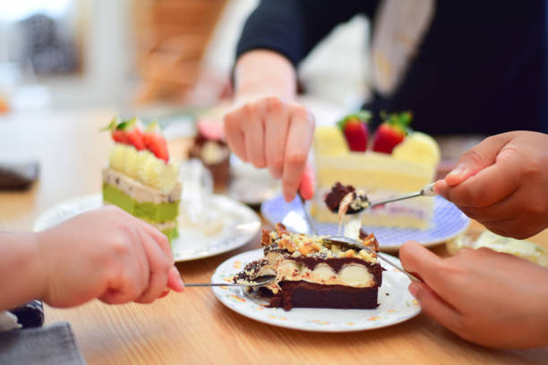 istock Group of People eating dessert in coffee. 1256986794