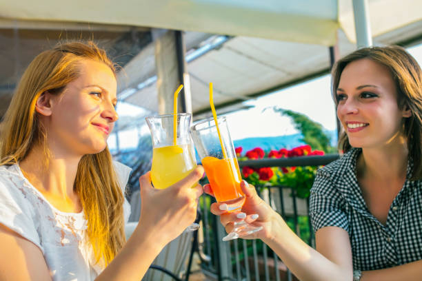 istock Female friends talking cafe 1256989074