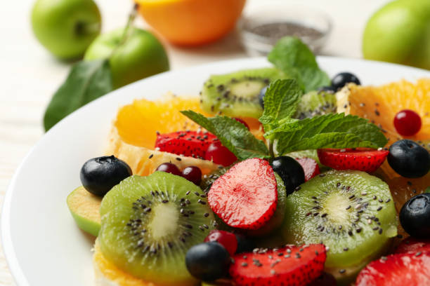 istock Plate of fresh fruit salad, close up 1256989090