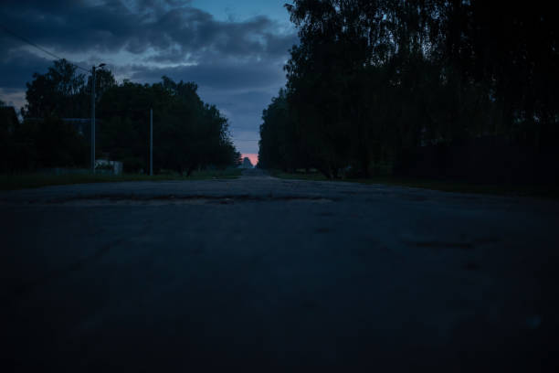 Village road at night during the late sunset