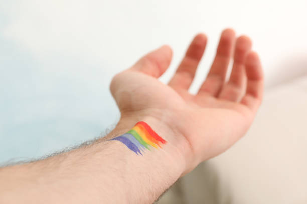 istock Male hand with LGBT rainbow, close up 1256991225