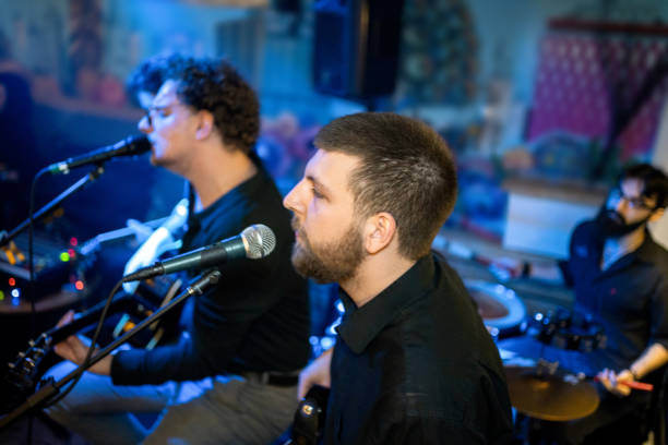 istock Rock band playing on the concert 1256992397