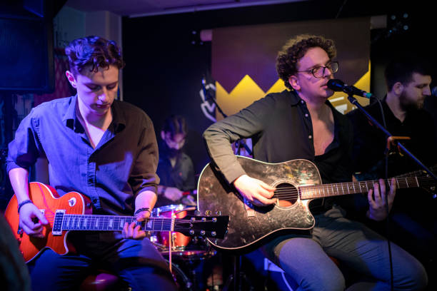 istock Rock band playing on the concert 1256992454