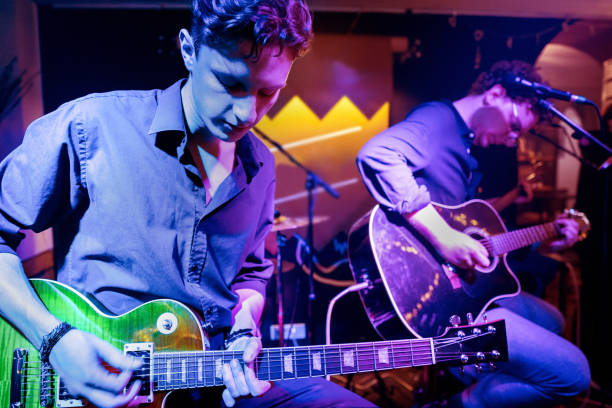 istock Acoustic performance by a rock music band 1256992470