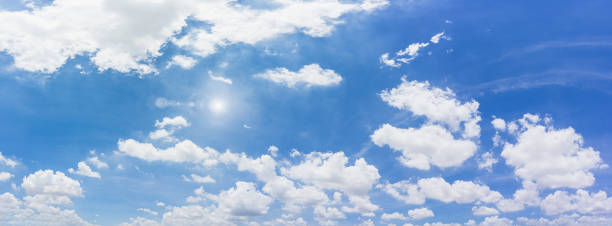 istock Panorama blue sky and clouds with sun and daylight natural background. 1256992764