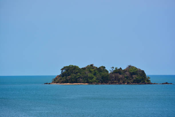 istock Small island on the blue sea and blue sky 1256993805