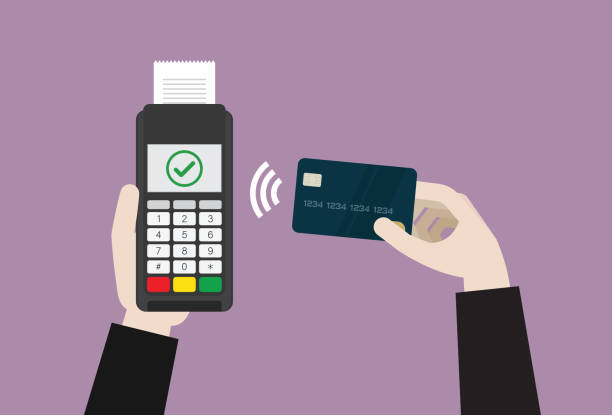 istock Businessman uses a credit card for contactless payment 1256993844