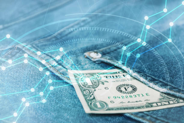 istock money in back blue jeans pocket denim background texture with digital graph chart.business online concept. 1256994042