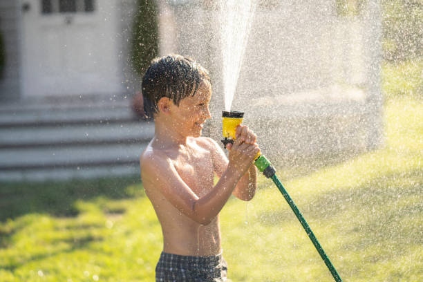 istock Garden hose fun in garden 1257000952