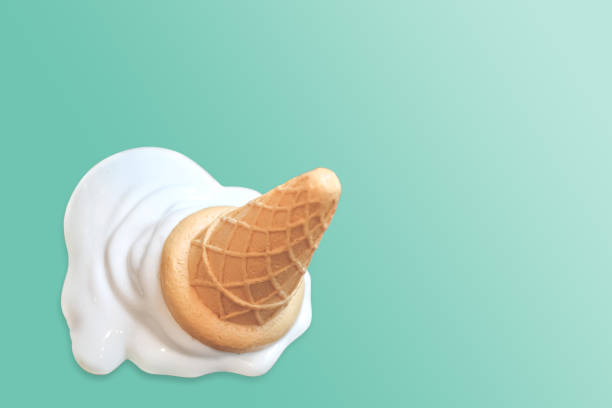 istock Ice cream cone fallen on blue vintage background. 1257001837