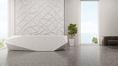 Luxury interior design of modern showroom with terrazzo floor and empty white tile wall background.
