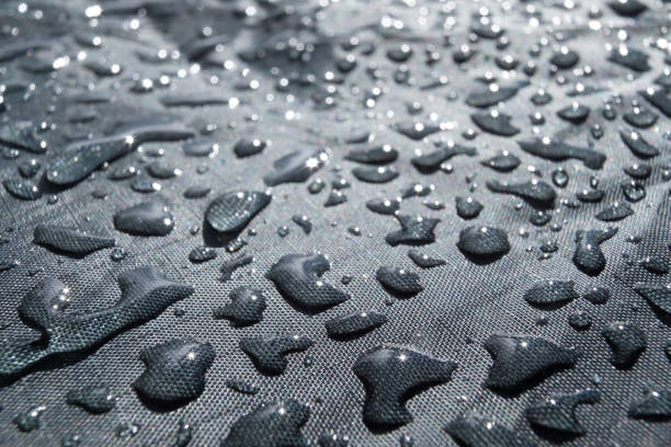 istock Rain water droplets on waterproof fabric for clothes 1257004014